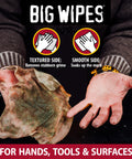 Heavy Duty Hand Cleaning Wipes With Textured Scrubbing Degreaser For Mechanics And Tool Pros In The Shop, dirty wipe held