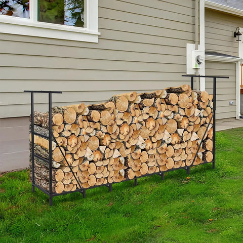 Backyard view of Eight Foot Outdoor Firewood Rack with Waterproof Carrier holding logs by house wall, adjustable steel holder