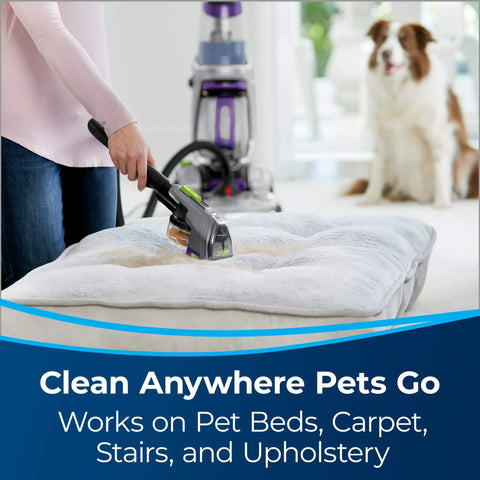 2-In-1 Pet Upholstery Tool for Carpet and Upholstery Cleaning on pet bed with BISSELL machine in background