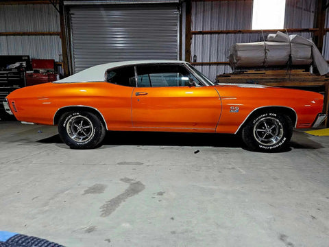 Showroom Smooth Dreamsicle Orange Basecoat Paint Gallon Ready To Spray Mix With Slow Reducer For Zero Hassle Street Car Restorations And Bumper To Bumper Shine on a classic car in a garage.