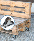 Set Of Four 1-1/2 Inch Low Profile Swivel Casters With Locking Brakes Quiet TPR Rubber Wheels installed on wooden pallet