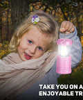 Child holding 2 Pack Mini LED Pink Camping Lanterns Portable Outdoor Handheld Lights for Camping Hiking Power Outages and Emergencies