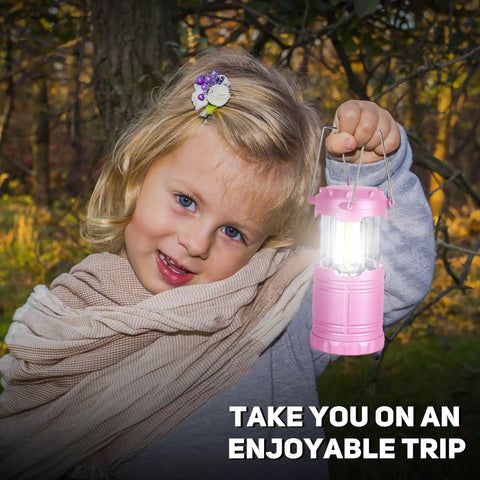 Child holding 2 Pack Mini LED Pink Camping Lanterns Portable Outdoor Handheld Lights for Camping Hiking Power Outages and Emergencies