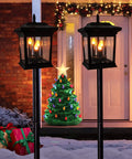 Outdoor Solar Lanterns Waterproof Hanging Lights for Garden Patio Lawn Pathway and Wall Flickering Ambience Durable IP65 Weatherproof No Wires Ideal Gift for Women and Home Decor Enthusiasts displayed in snowy garden with Christmas decor.