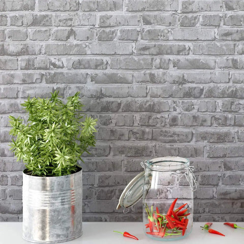Grey Faux Brick Peel And Stick Wallpaper Roll 17.7 By 472 Inches Self Adhesive Vinyl Film for Easy DIY, plant pot and glass jar displayed.