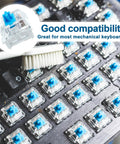 Close-up of Blue Switch Replacement 3-Pin Mechanical Keyboard Switches showing installation on a keyboard with cleaning brush