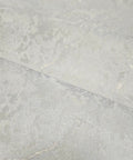 Ivory And Off White Rose Gold Cracked Faux Concrete Plaster Textured Wallpaper Rolls showing matte surface detail for DIY room decor.