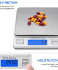 On The Go Pocket Scale With 2000g Capacity And 0.1g Precision displaying capsules, LCD shows count and hold function