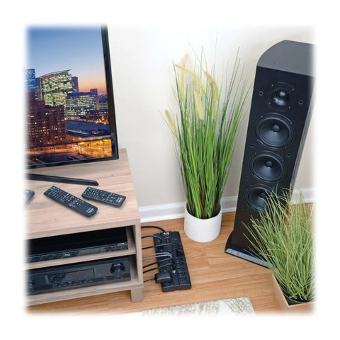 Living room setup with Home Theater Surge Protector Power Strip with 12 Outlets 2160 Joules behind sound system.