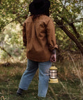 Person holding Dusty Yellow Forest Lantern Vintage Rechargeable Led Lantern With Adjustable Brightness Battery Operated Camping Light outdoors