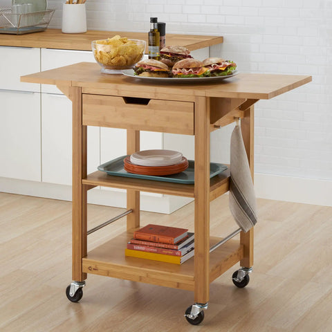 Premium Bamboo Extendable Rolling Kitchen Cart With Collapsible Drop Leaves And Deep Storage Drawer in kitchen with food.