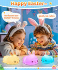 Children smiling with Kawaii Squishy Bunny Night Light For Kids With 16 Colors LED Glow Soft Silicone Bunny Lamps in Easter setting.
