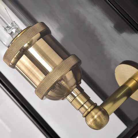 Close-up of solid brass Dope Outdoor Wall Lanterns Set Of Two in waterproof exterior sconce with clear glass panels.