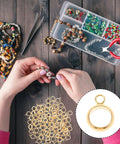 Hands working with jewelry using Top Shelf Stainless Steel Bail Beads For Jewelry Making Supplies Featuring Durable Charm Hangers.