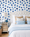 Super Sleek Blue And White Polka Dot Peel And Stick Wallpaper For Kids Rooms And Nurseries Zero Mess Peel And Apply Removable Self Adhesive Vinyl Watercolor Accent Wall Decor Refresh used on a bedroom wall behind a bed.