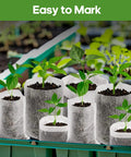 Eco Friendly Biodegradable Plant Grow Bags 5.5x6.3 Inches 200 Pack Non Woven Seed Starter Pots with seedlings in greenhouse
