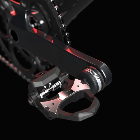 Assioma Duo Power Meter Pedal System with rechargeable batteries on bike crank, for accurate cycling power measurement.