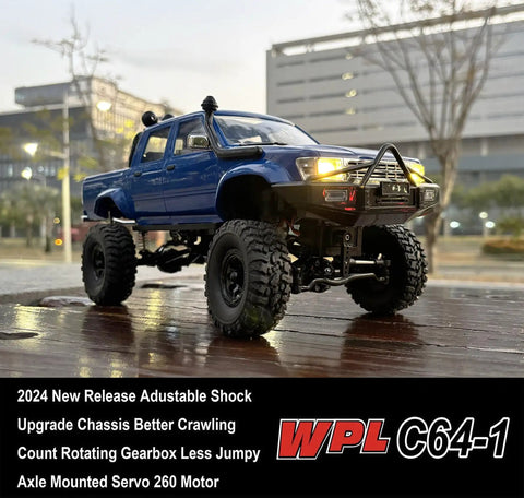 Beefed Up 1/16 Scale RC Rock Crawler With 4x4 Drive All Terrain Off Road Pickup RTR Hobby Grade Vehicle showing front view on wet pavement.