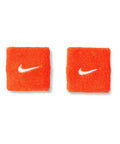 Classic Swoosh Wristbands 2 Pack For Adults Unisex Sweatbands With Absorbent Terry For Sweat Control On Gym Day Or Training Dry Comfort Easy To Wash Team Orange And White orange terry wristbands set on white background