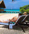 Two lounge chairs on beach with Ultra Plush Micro Fleece Lounge Chair Towel Cover Set Of 2 With Quick Dry Non Slip Backing.
