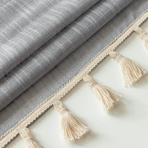 Close-up of Linen Textured Swag Curtain Valance With Rod Pocket showing gray fabric and tassel details, 36W X 36L, soft linen polyester blend.