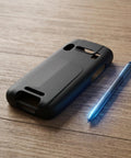 Tough As Nails Nonslip Boot With Crush Proof Armor And Tight Fit For K3S Barcode Scanner on wooden surface next to a blue stylus.