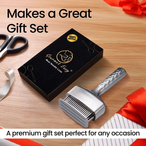 Meat tenderizer tool with textured stainless-steel handle and ribbed blade head beside a black gift-set box.