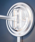 Close-up of hinge on Theta Wall Swing Arm Lamp In Brushed Steel Finish, showing adjustable mechanism.