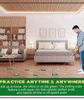 Man practicing golf putting in a bedroom with 1 To 3 Hole Golf Putting Practice Cups With Plastic Flags Set For Indoor Outdoor Training.
