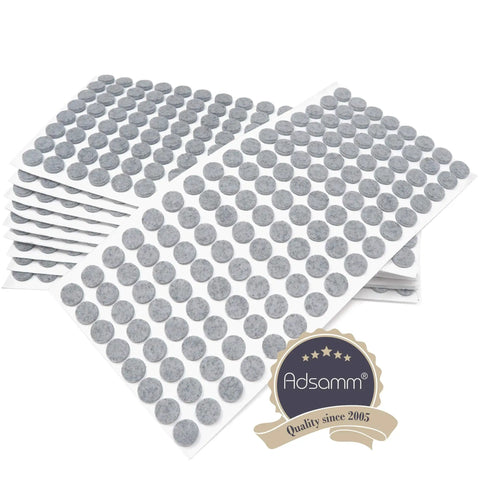 Hassle Free Real Deal Self Adhesive Felt Pads 1280 Pack Grey Round Furniture Glides each 0.47 inch thick for chair leg protection.