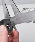 Dial Caliper With 0-6 Inch Range, Precision To 0.001 Inch, measuring metal part, focus on knurled lock and dial, durable black body