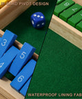 Close-up of Shut The Box Dice Game Wooden Board Game showing blue and green numbered pieces, dice, and waterproof lining for 2-4 players.