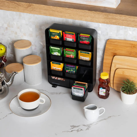 Tea Bag Organizer Station For Countertop And Kitchen Storage, Black Plastic, 10.25L X 3.25W X 13.75H Inches on marble counter