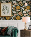 Living room with Vintage Floral Peel And Stick Wallpaper With Daisy Leaf Pattern In Black Sand And Olive Vinyl Self Adhesive Contact Paper For Walls 17.7 In By 9.8 Ft Removable Repositionable And Renter Friendly, featuring floral pattern, framed art, lamp on wooden side table.