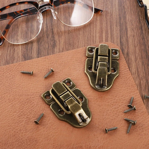 Two Pack Antique Bronze Duckbilled Hasp Clasp Latch Hardware Bronze Toggle Hasp Latches With Screws on leather surface