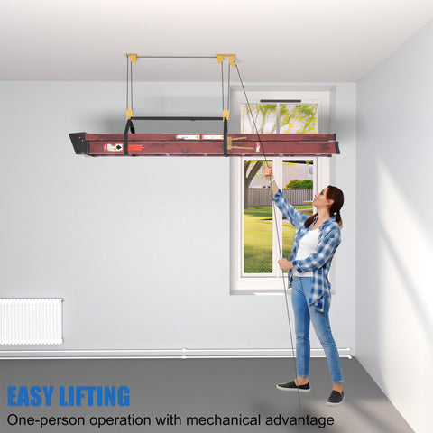 Person using Ladder Storage Pulley Hoist Self Locking Hanger For Garage Ceiling Lift System Holds 100 Lb, Fits 10 To 18 Foot Ceilings