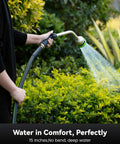 Person using Heavy-Duty 16-Inch Garden Hose Wand with 9 Spray Patterns to water shrubs, leak-free and easy to grip nozzle