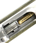 Multi Caliber Laser Bore Sight Kit With Bright Red Cartridge Sighter For Zeroing Rifle Scopes And Aligning Iron Sights showing brass laser cartridge in firearm chamber.