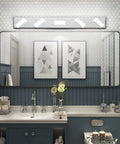 Modern Stainless Steel 3 Light LED Vanity Light Fixture With Frosted White Acrylic Shades above bathroom mirror