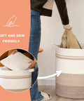 Person placing items in 80L Laundry Hamper With Handles Decorative Woven Storage Basket for Living Room and Nursery Gradient Yellow 20x18 Inches