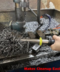 No Sweat Neodymium Shop Magnet Wand With Telescoping Pole and Snappy Release Trigger cleaning metal shavings from a workbench.