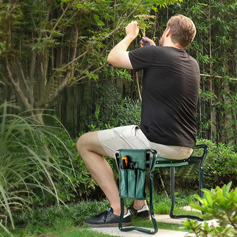 Person sitting on Versatile Garden Kneeler And Seat Foldable Bench With Tool Pouch in garden setting, focusing on DIY yard projects.