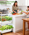 Woman and girl with movable two layer indoor hydroponic garden system with 54 pods and 30W LED grow light beside kitchen counter