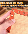 Hand using Mini Center Finder Tool 90 Degree Precision Machinist Square Quick Measuring Square For Woodworking Pocket Layout Carpenters Square With Extended Body And Pencil Friendly Center Marking Hole against wood edge