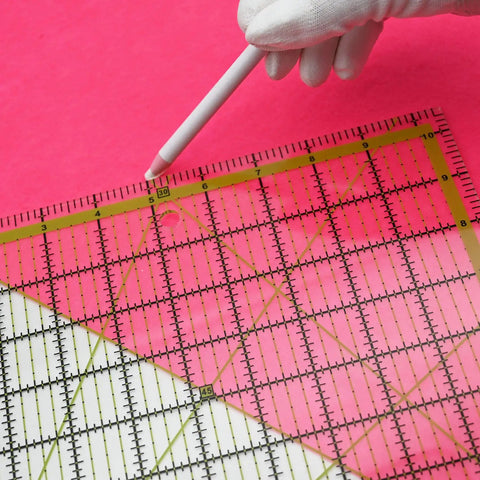 Game Changer Clear Acrylic Quilting Ruler Set for Precise Cutting with green markings on pink background