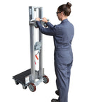 Premium Aluminum Manual Load Lift With Hand Crank Winch And Smooth Rollin Swivel Casters 24 By 20 Inch Platform in use.