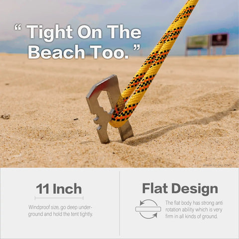Six Pack 11 Inch Stainless Steel Tent Stakes For Camping Gear Heavy Duty Ground Anchors in sand with rope attached.