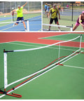 Pro Grade Official Regulation 22 By 3 Foot Pickleball Replacement Net For Indoor And Outdoor Play with players on court