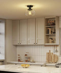 Industrial Semi Flush Mount Ceiling Light with Clear Glass Shade and Matte Black Finish installed in a modern kitchen