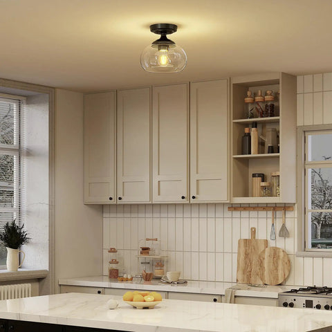 Industrial Semi Flush Mount Ceiling Light with Clear Glass Shade and Matte Black Finish installed in a modern kitchen